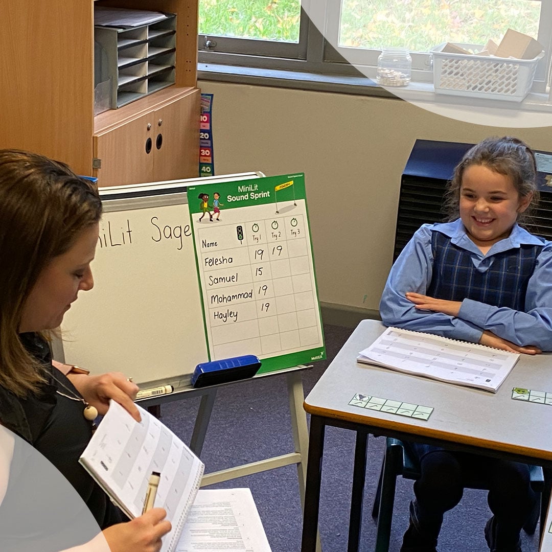 Teacher helping child to read